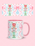 Pink watercolor Christmas mug wrap with nutcracker soldiers, oversized bows, blue greenery, ornaments, and a coordinating mug mockup.
