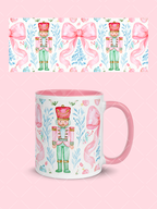 Pink watercolor Christmas mug wrap with nutcracker soldiers, oversized bows, blue greenery, ornaments, and a coordinating mug mockup.
