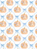 Watercolor seamless pattern of peachy orange floral pumpkins and blue bows arranged within a pale blue ribbon lattice on white