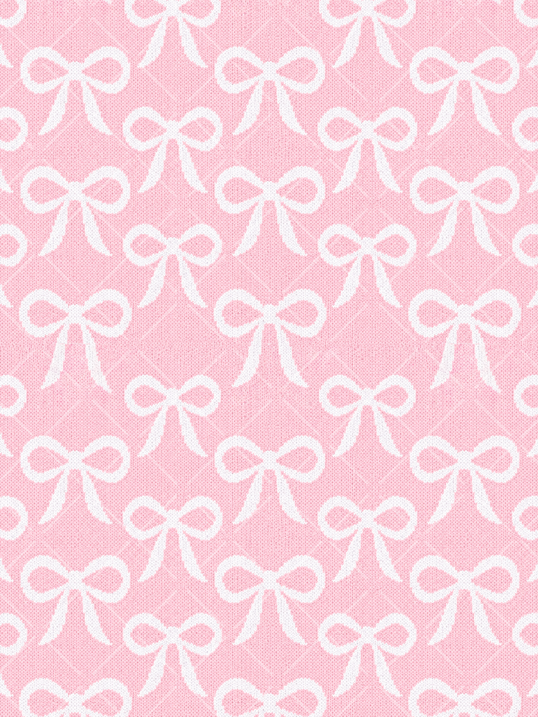 Seamless pattern of white ribbon bows arranged on a pink knitted-texture background